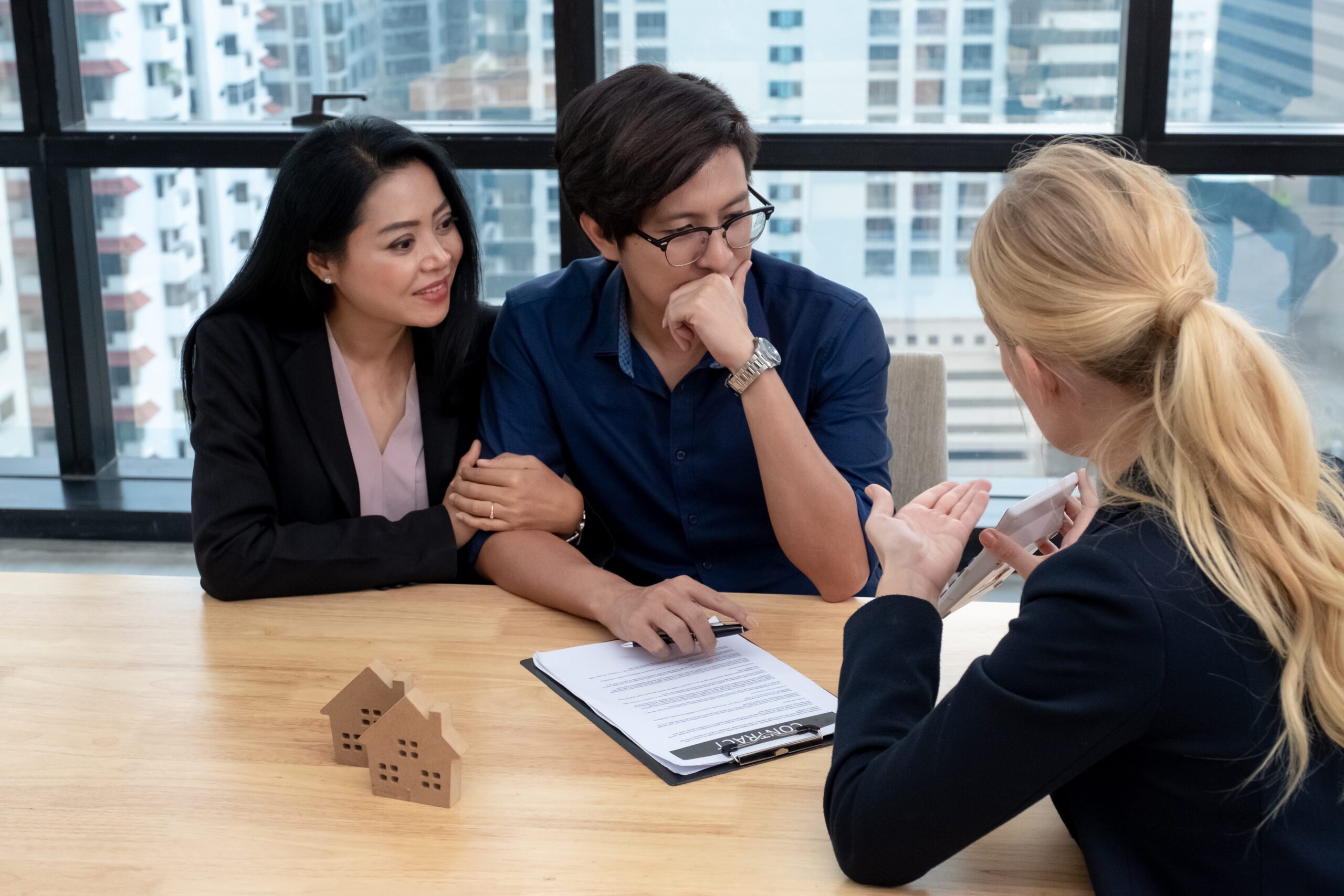 Couple Having A Discussion With The Realty Agent